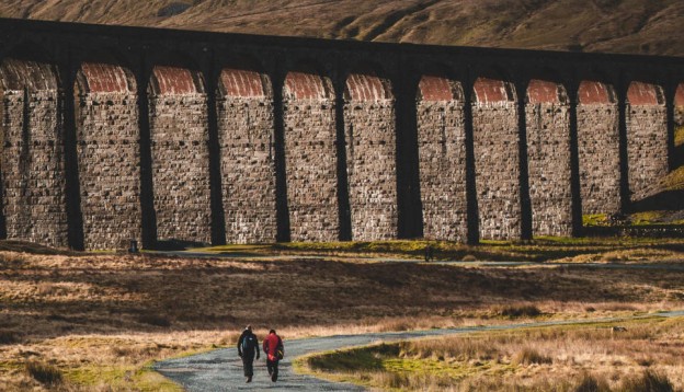 Walking below a viaduct in the Yorkshire Dales