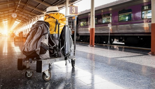 Luggage in trolley on train platform