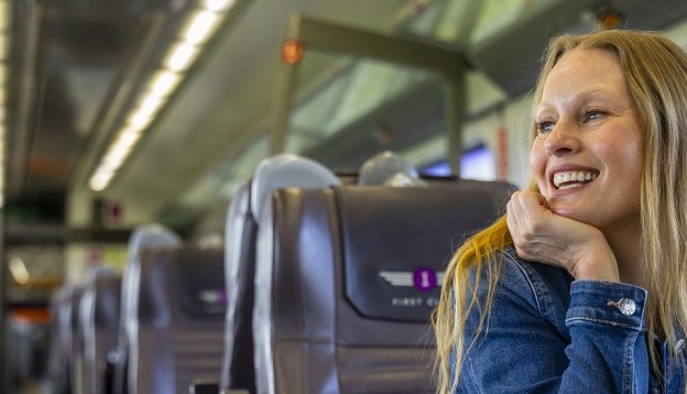 woman smiling in First Class 