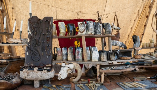 table showing old Viking jewellery, cutlery and drinking vessels